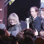 Lucinda Williams greeting fans by the stage.