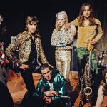 The members of Roxy Music face the camera